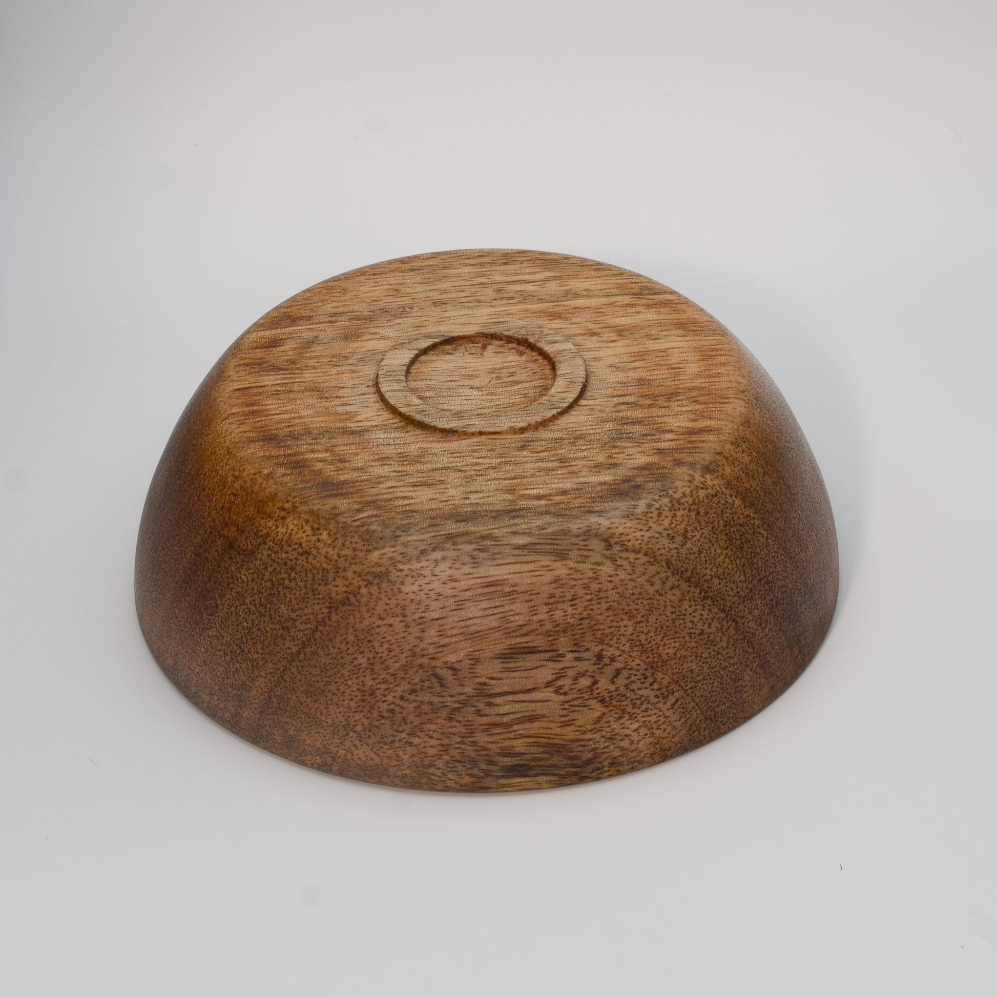 Mango wood bowl against white background
