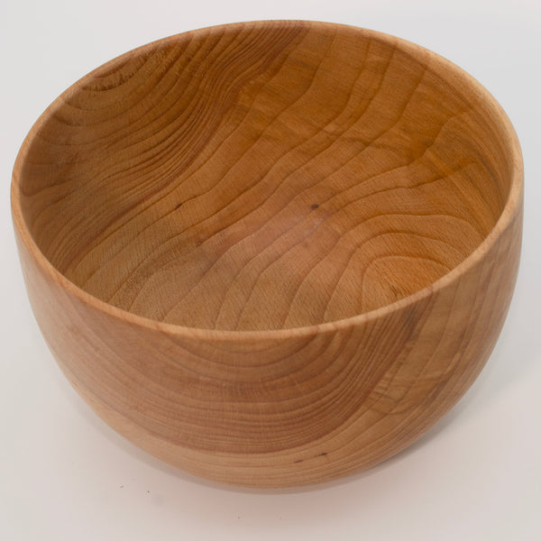 Wooden bowl on a white background