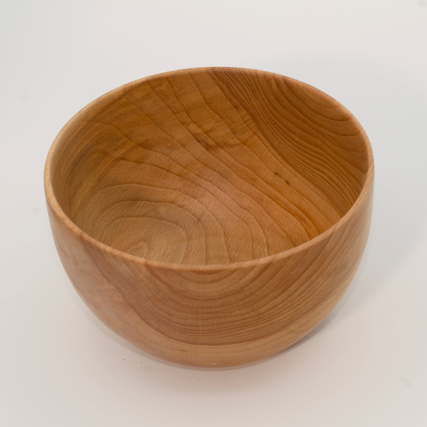 Wooden bowl on a white background