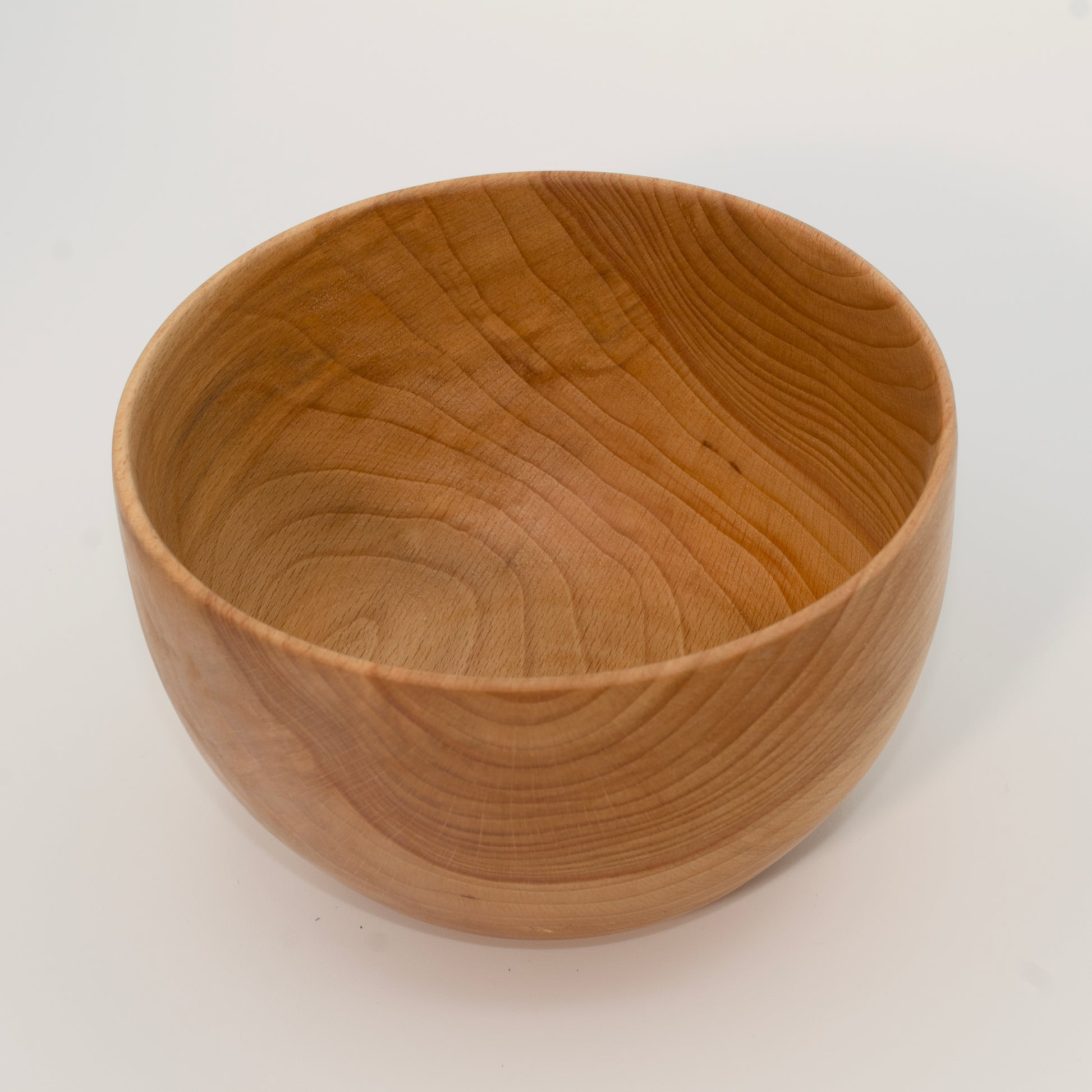 Wooden bowl on a white background