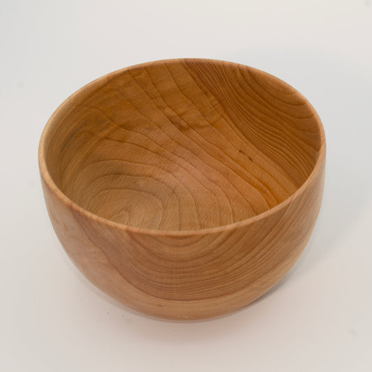 Wooden bowl on a white background