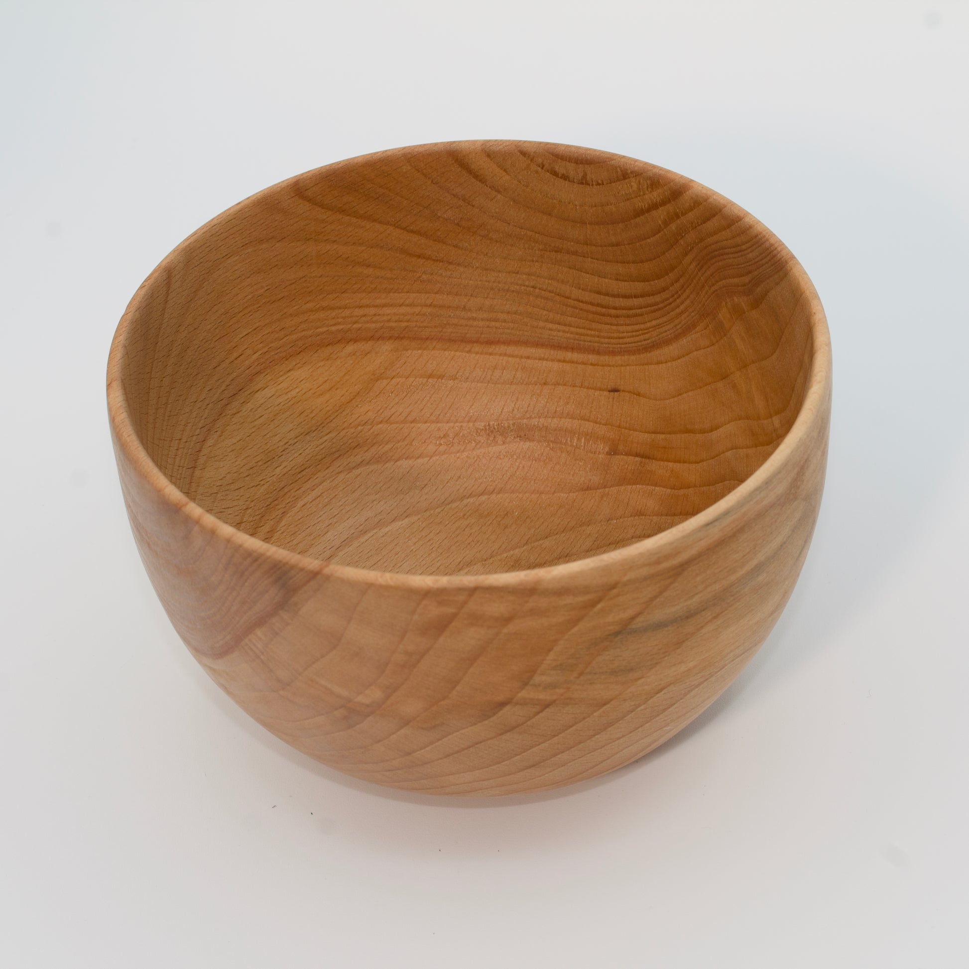 Wooden bowl on a white background