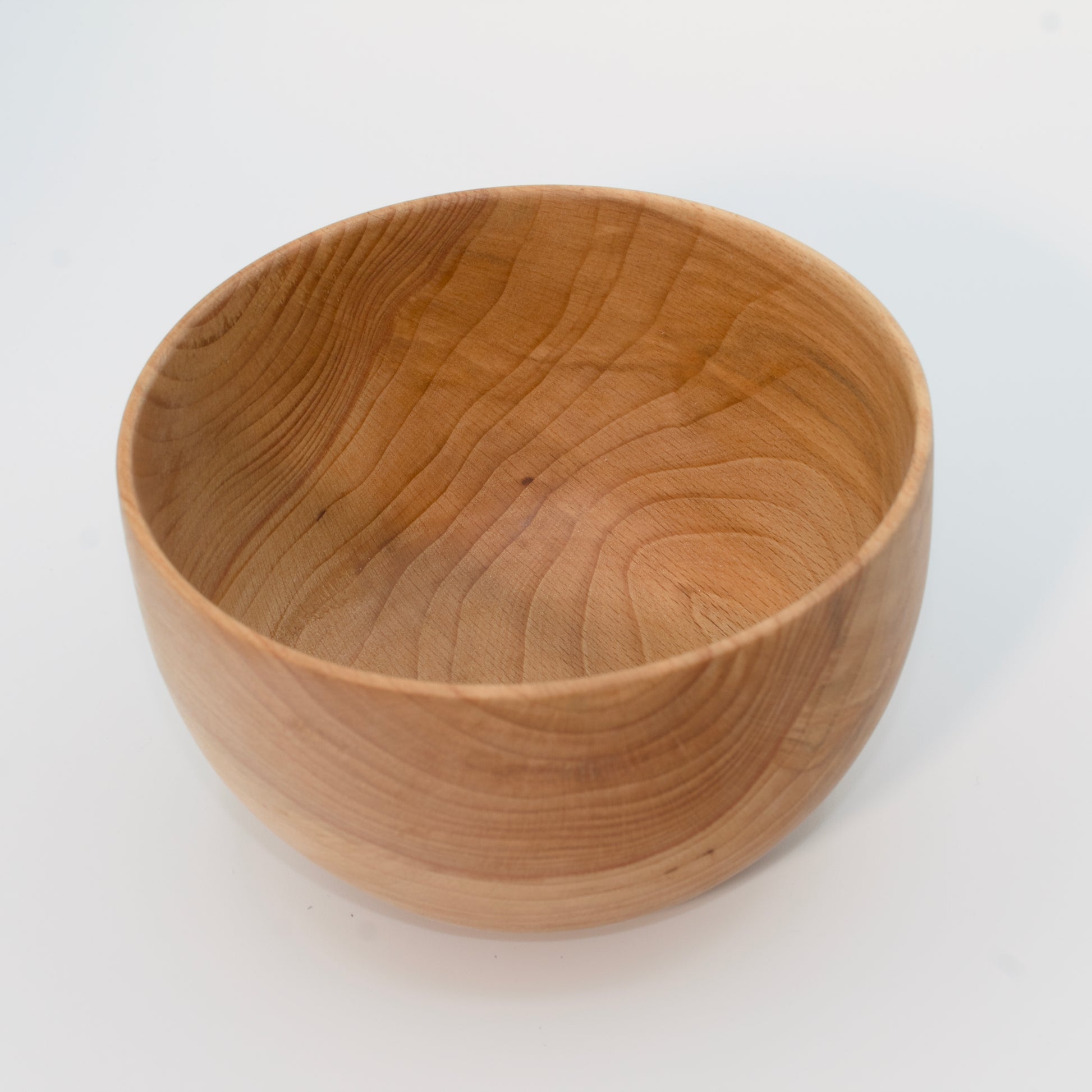 Wooden bowl on a white background