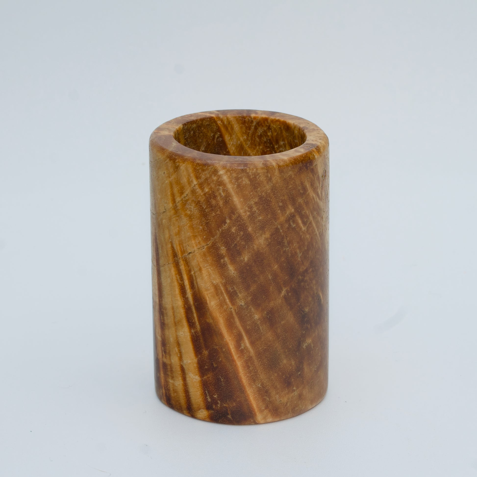 Box elder burl wood shot glass against white background