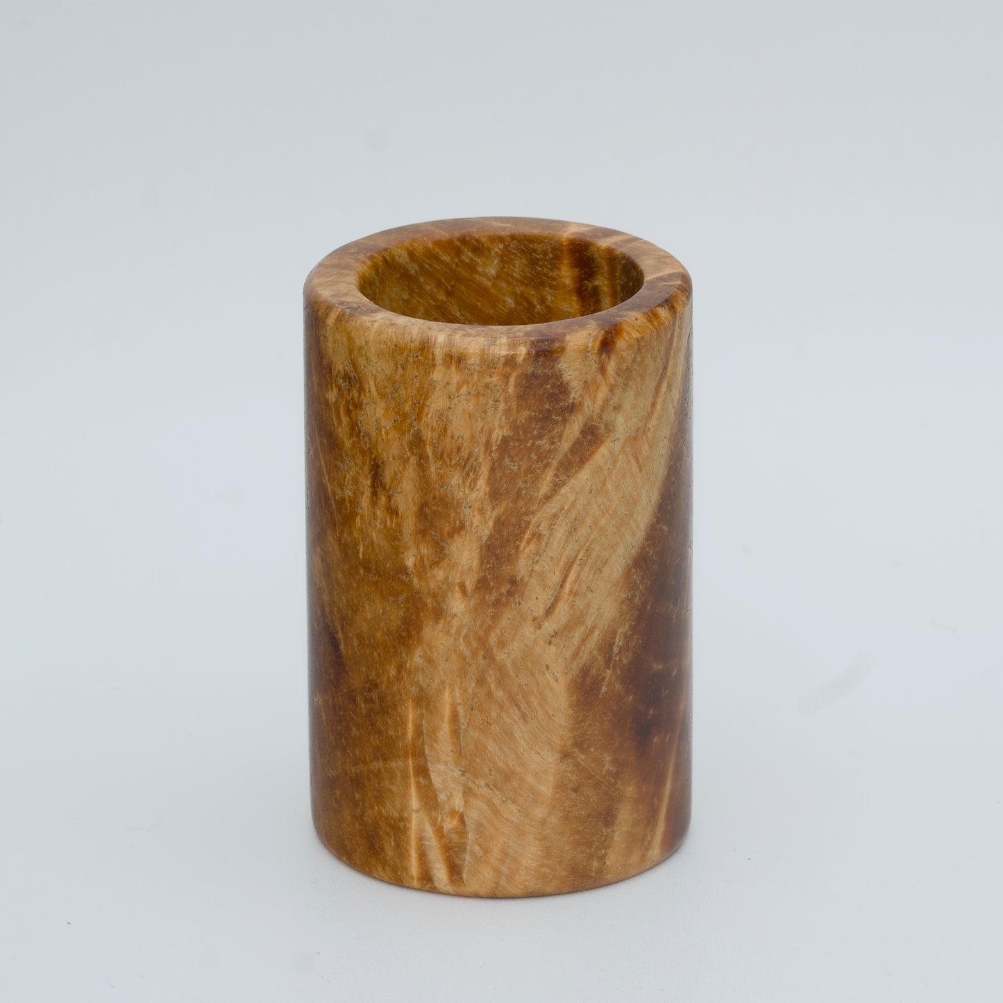 Box elder burl wood shot glass against white background