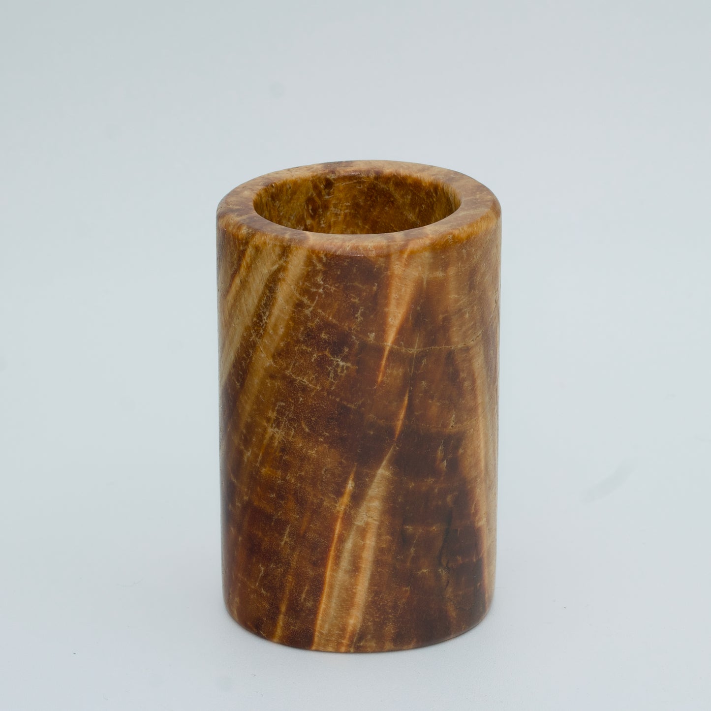 Box elder burl wood shot glass against white background