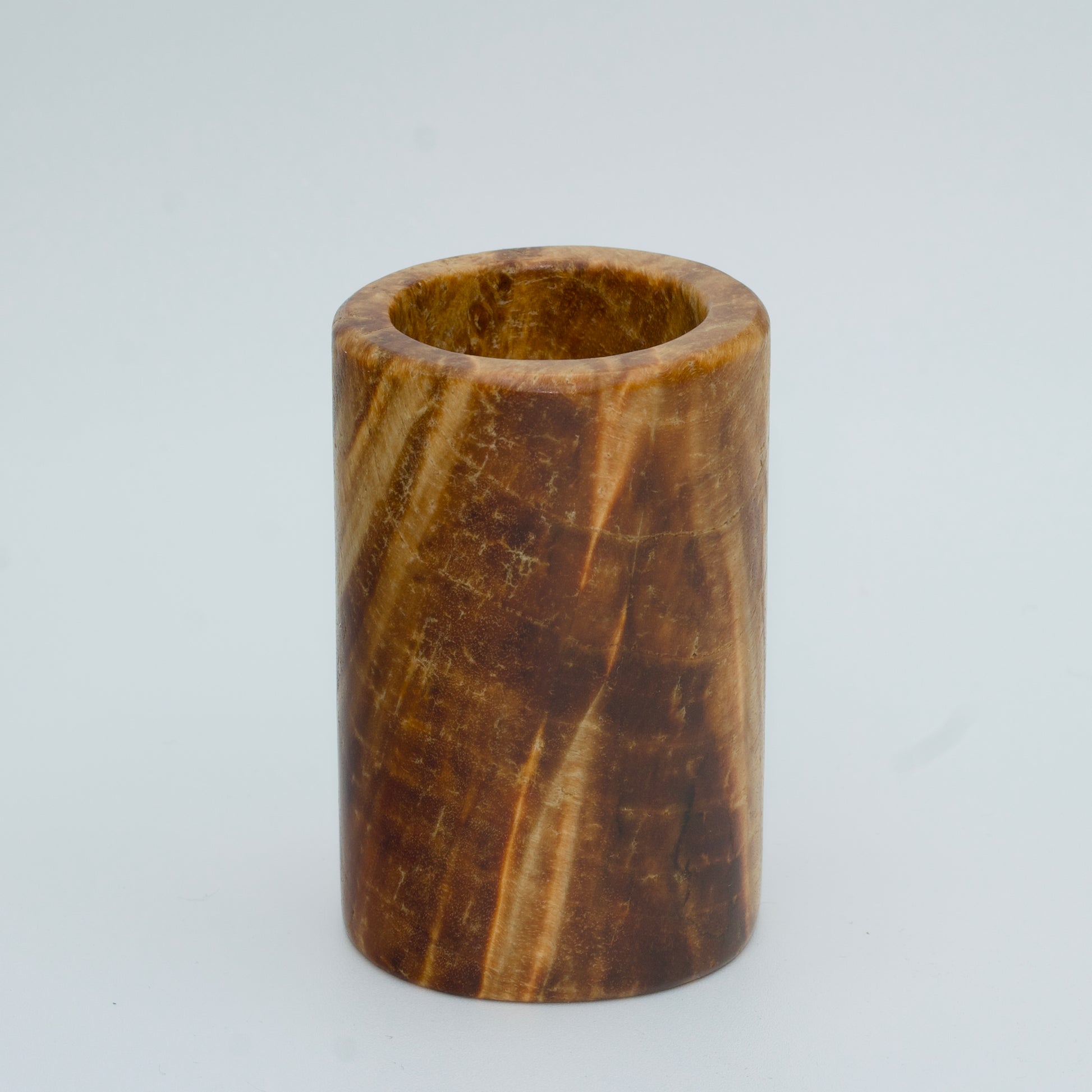 Box elder burl wood shot glass against white background
