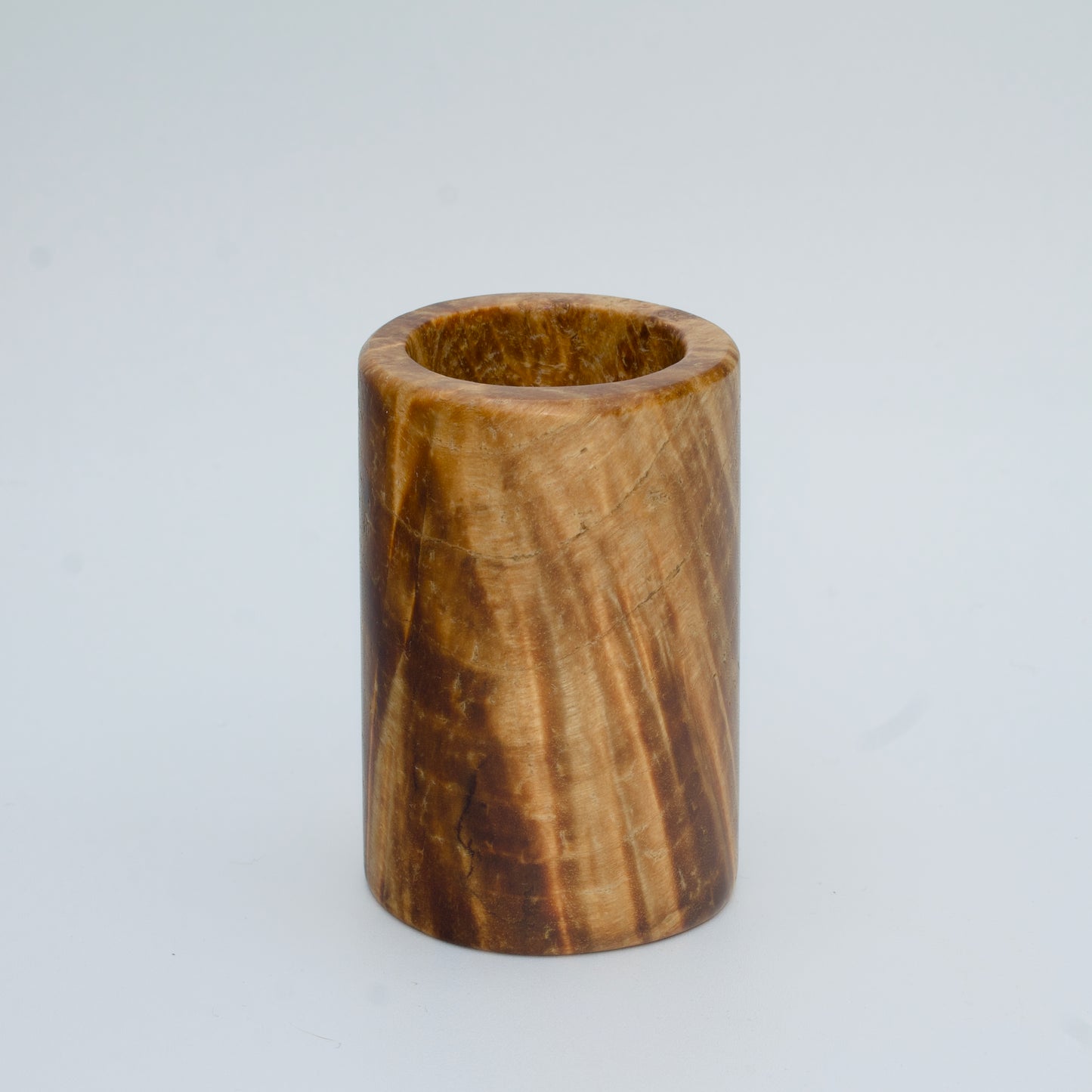 Box elder burl wood shot glass against white background