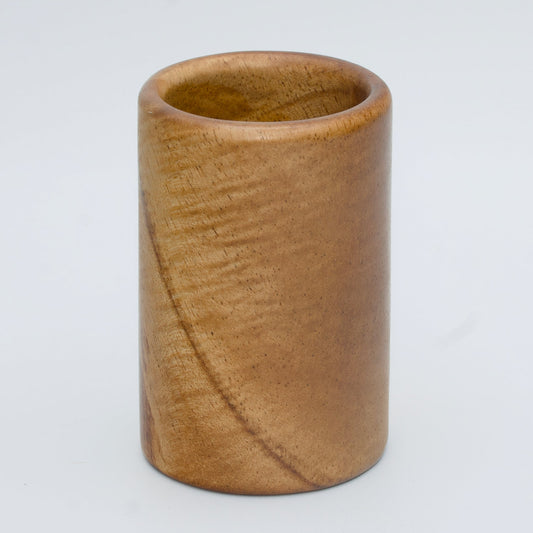Acacia wood shot glass against white background