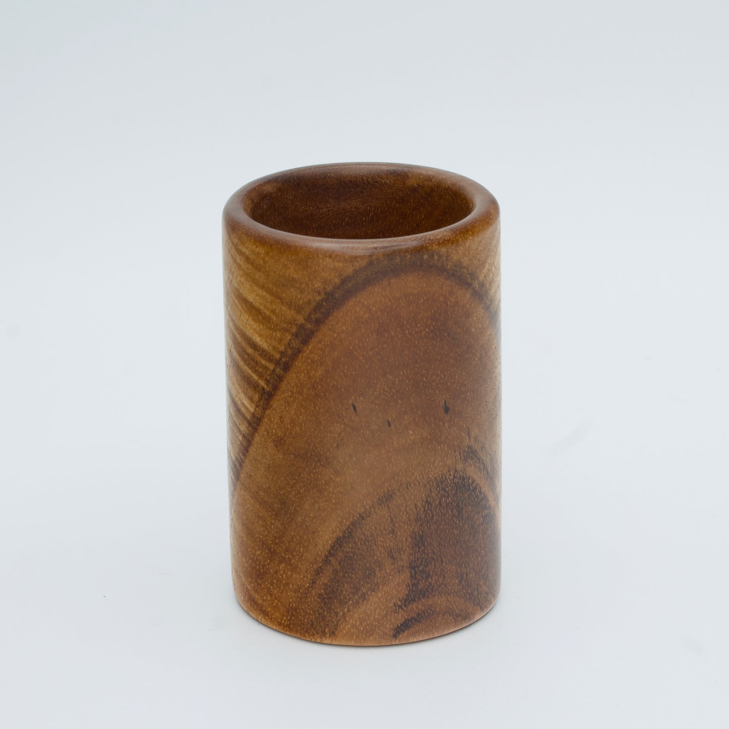 Acacia wood shot glass against white background