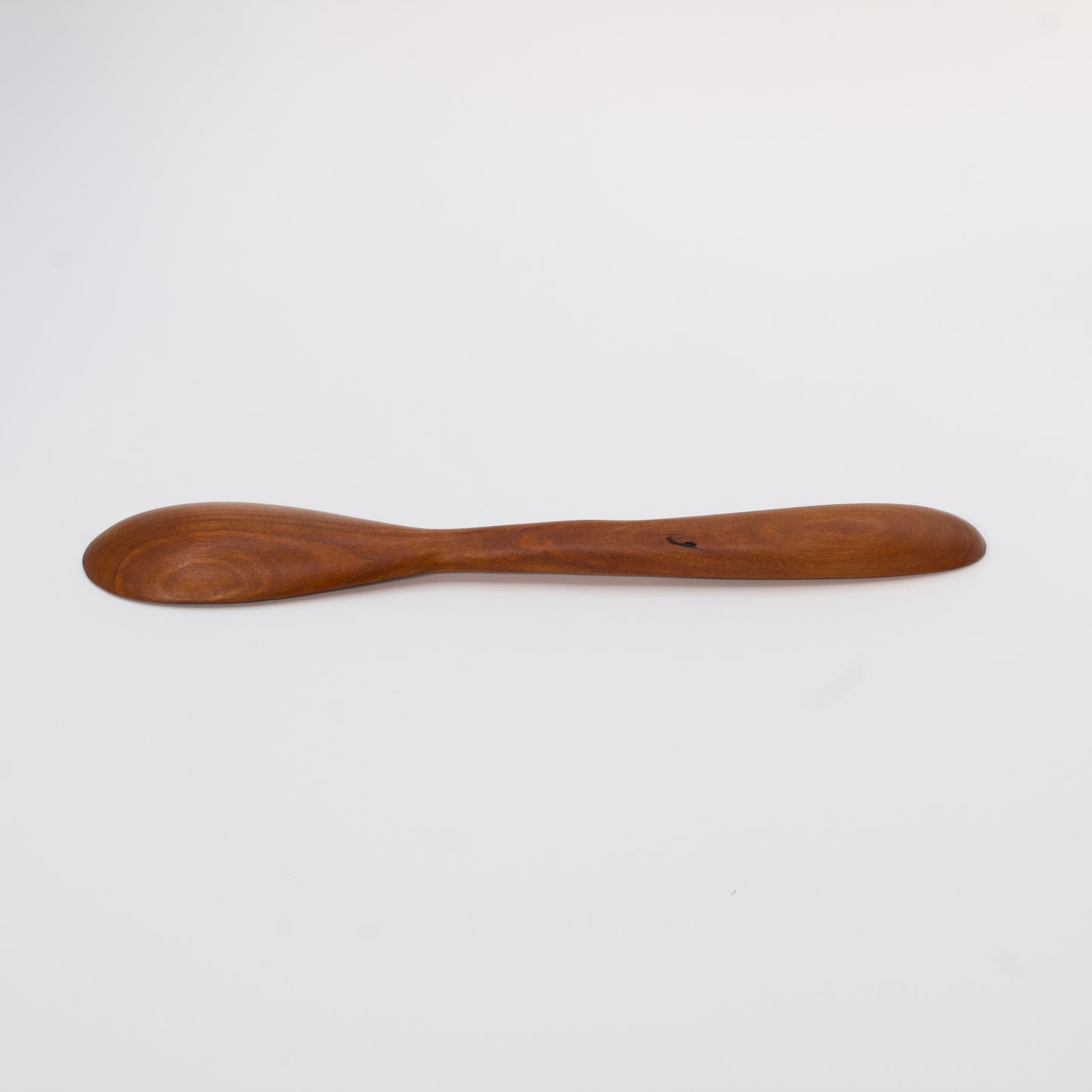 Wooden spoon on a white background