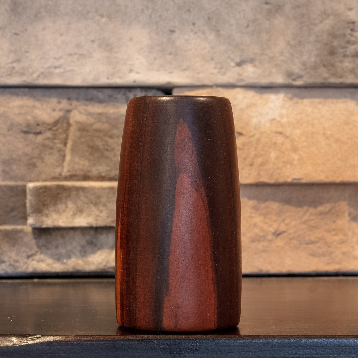 The First Lesson Eastern Redbud shot glass showing flame-like reddish figure against dark heartwood