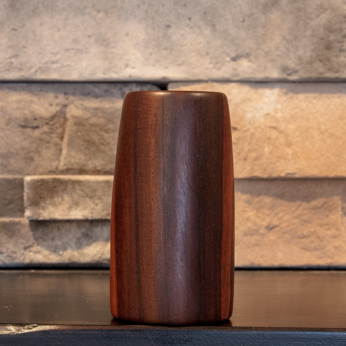 Eastern Redbud shot glass showing broad dark and reddish-brown vertical grain