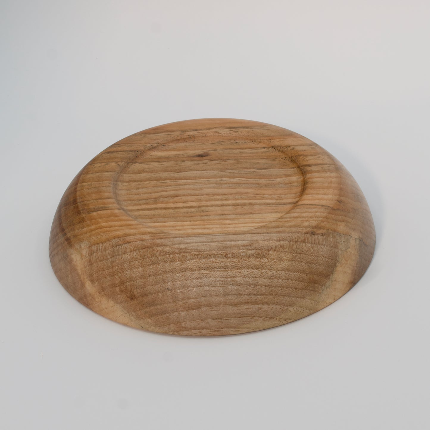 Wooden bowl on a white background