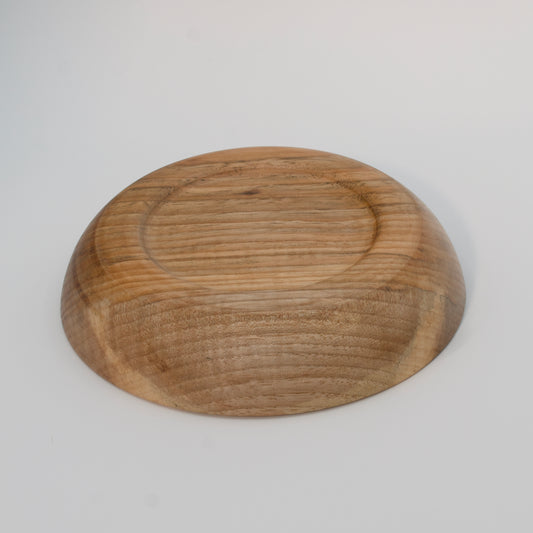 Wooden bowl on a white background
