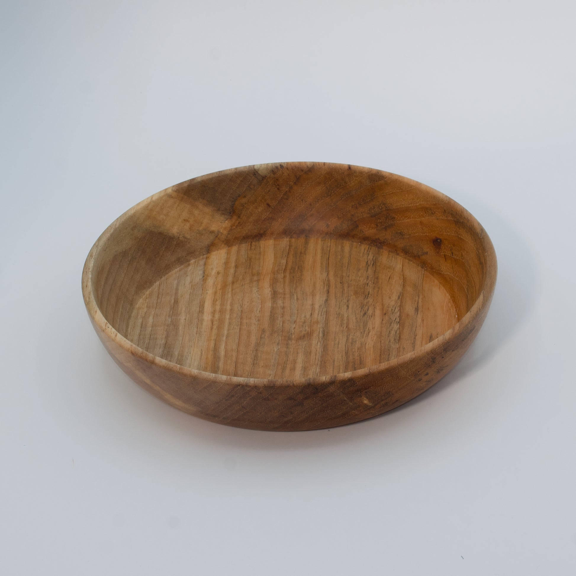 Wooden bowl on a white background
