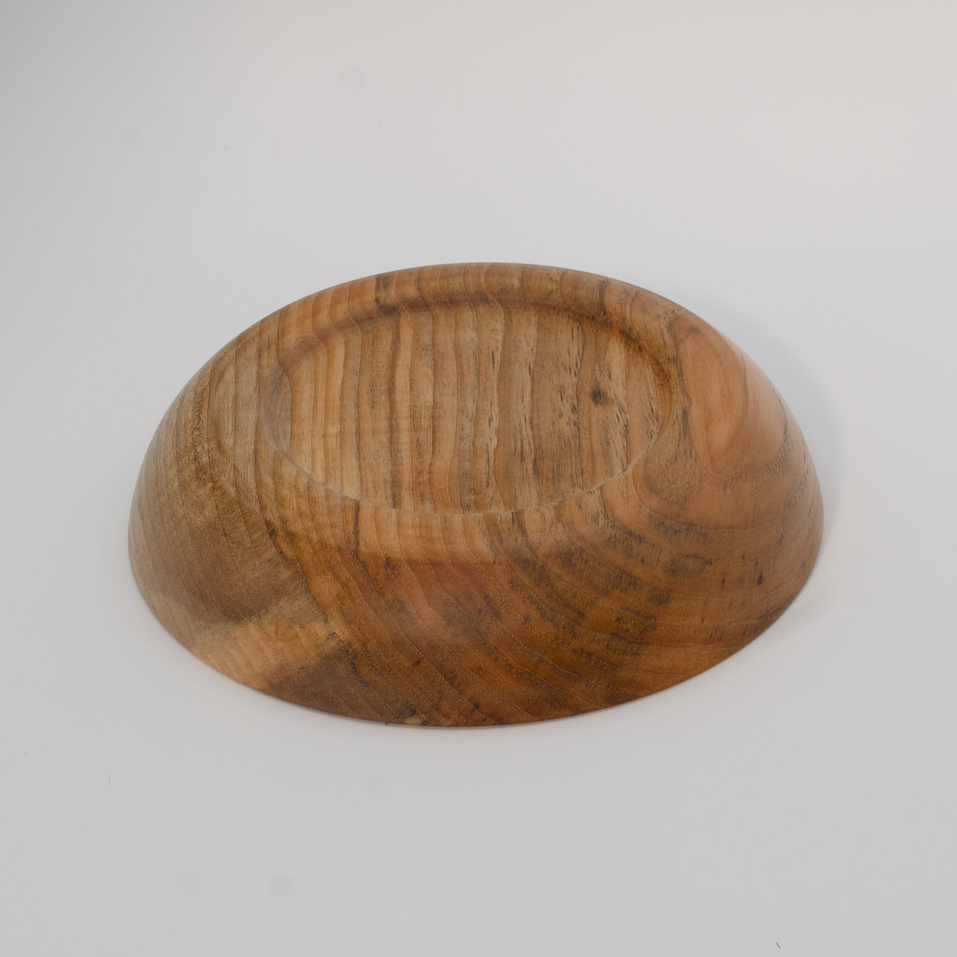 Wooden bowl on a white background