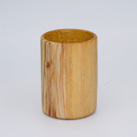Aspen wood shot glass with gold dye against white background