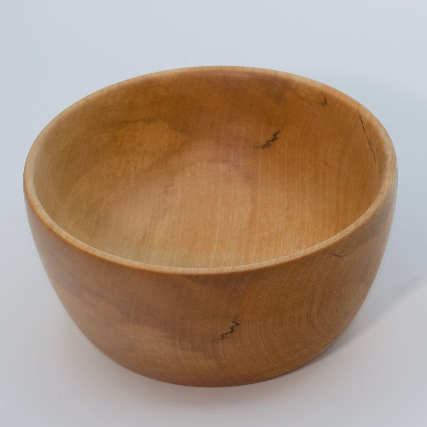 Wooden bowl on a white background
