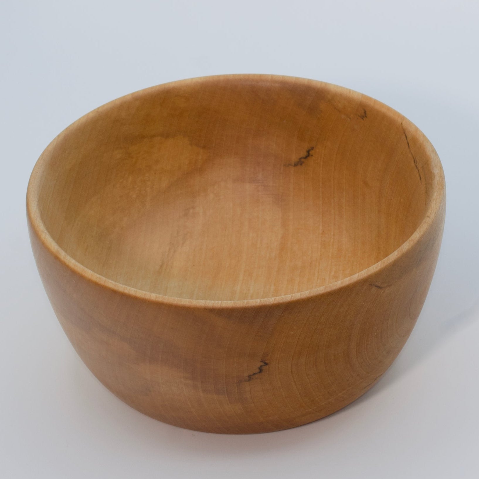 Wooden bowl on a white background