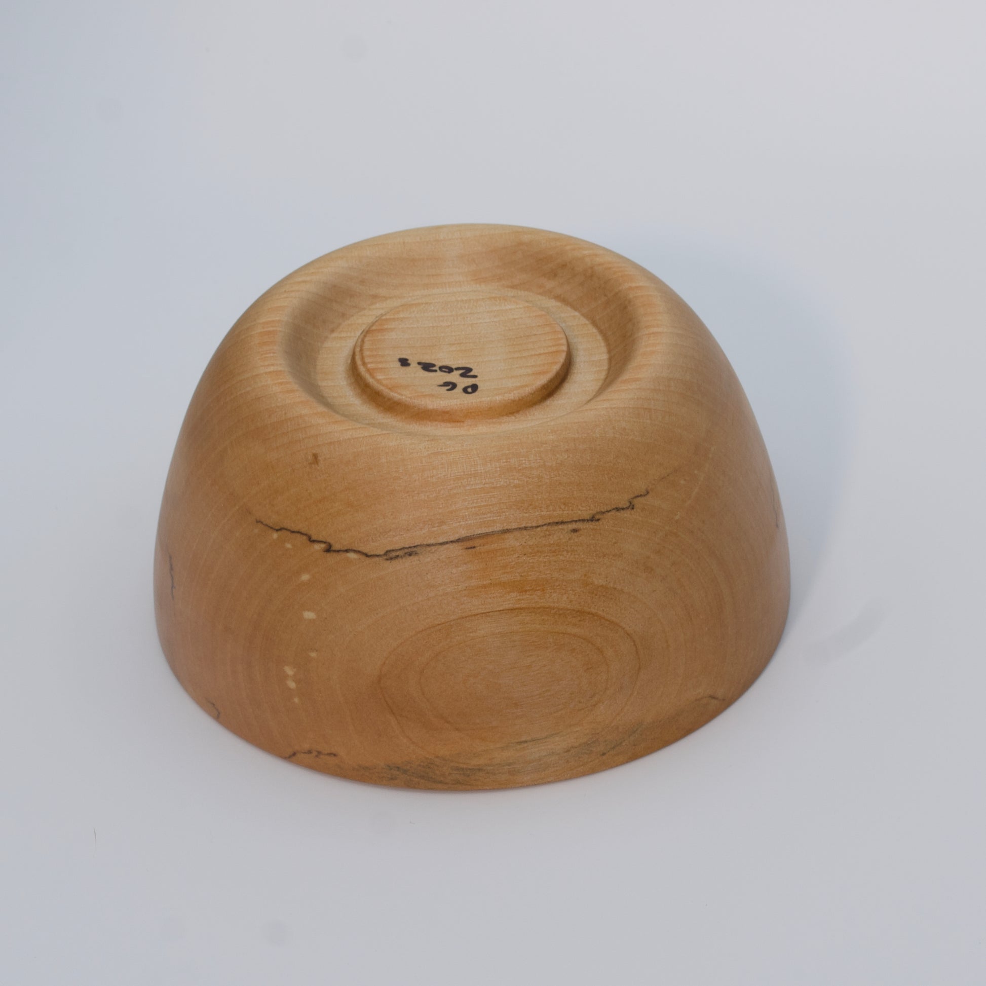 Wooden bowl on a white background