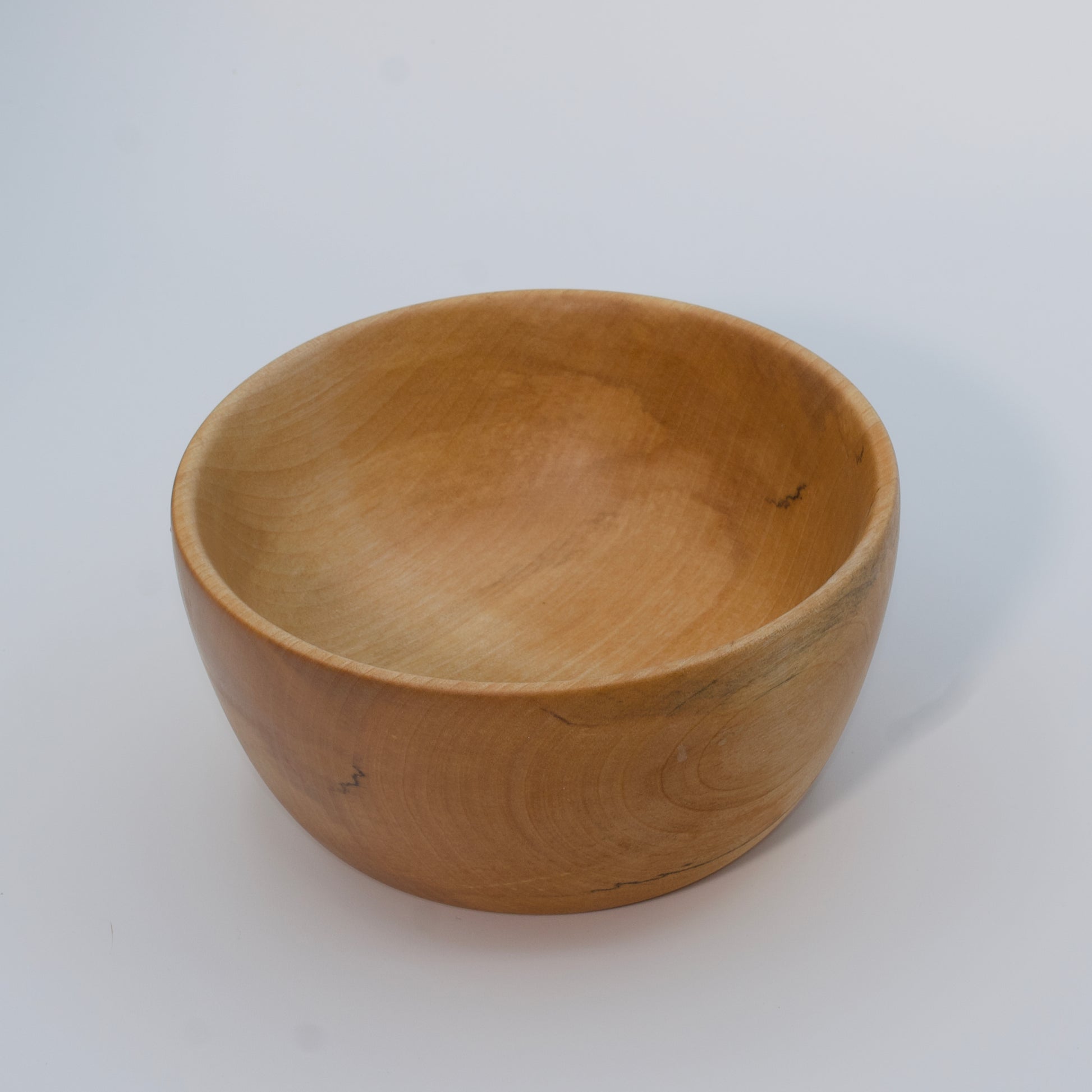 Wooden bowl on a white background
