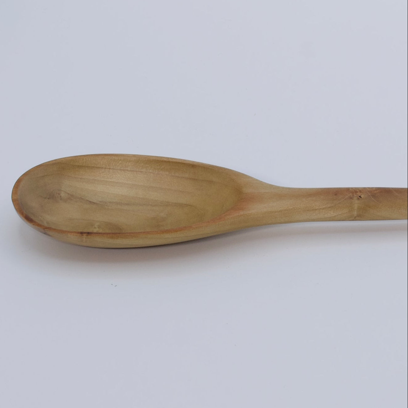 Wooden spoon on a white background