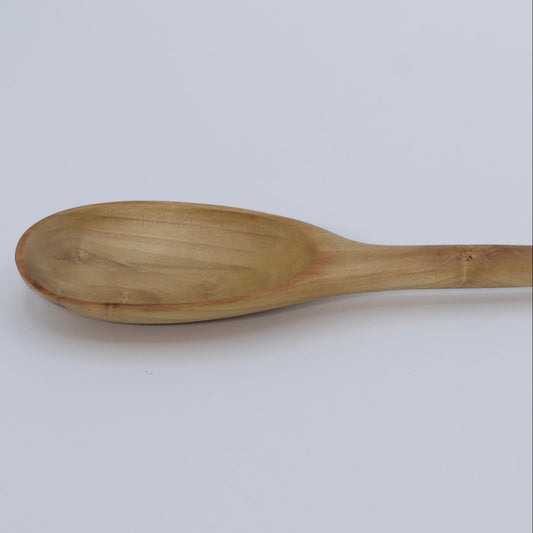 Wooden spoon on a white background