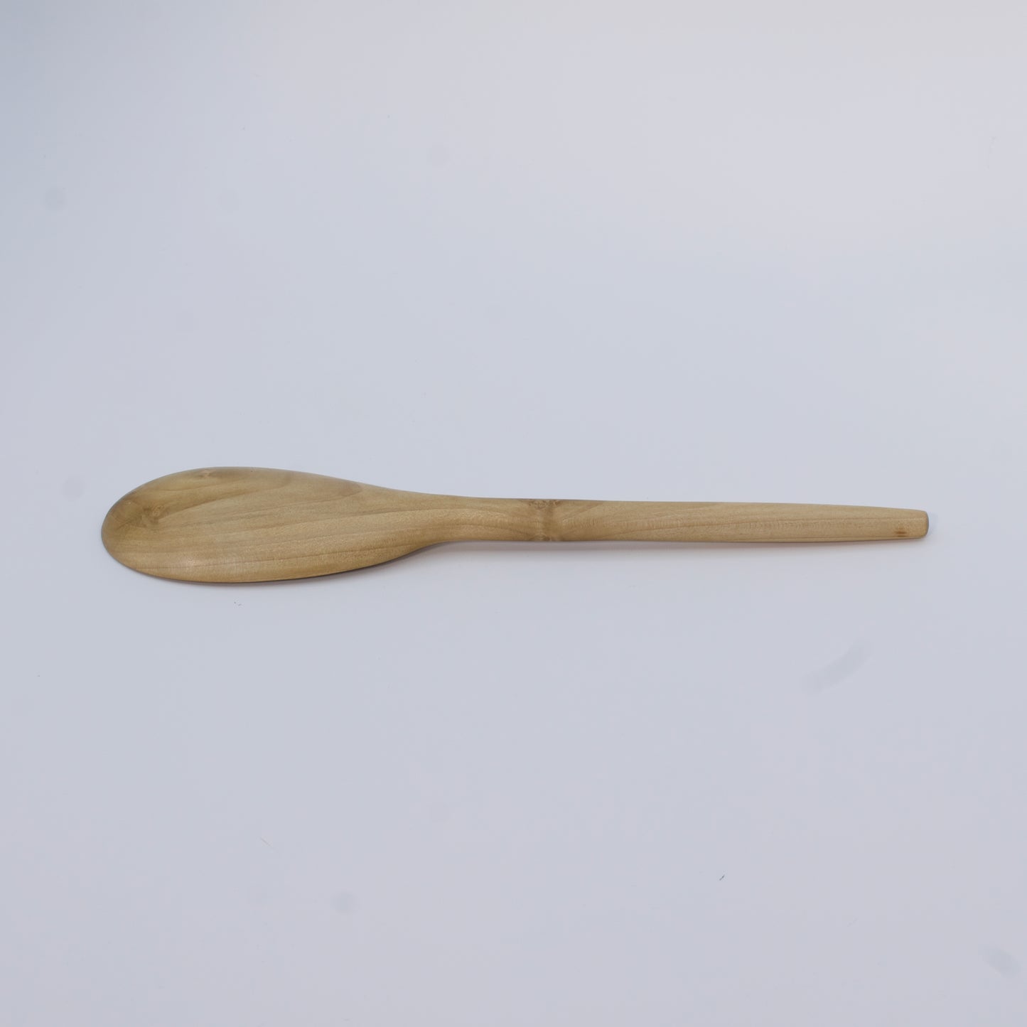 Wooden spoon on a white background