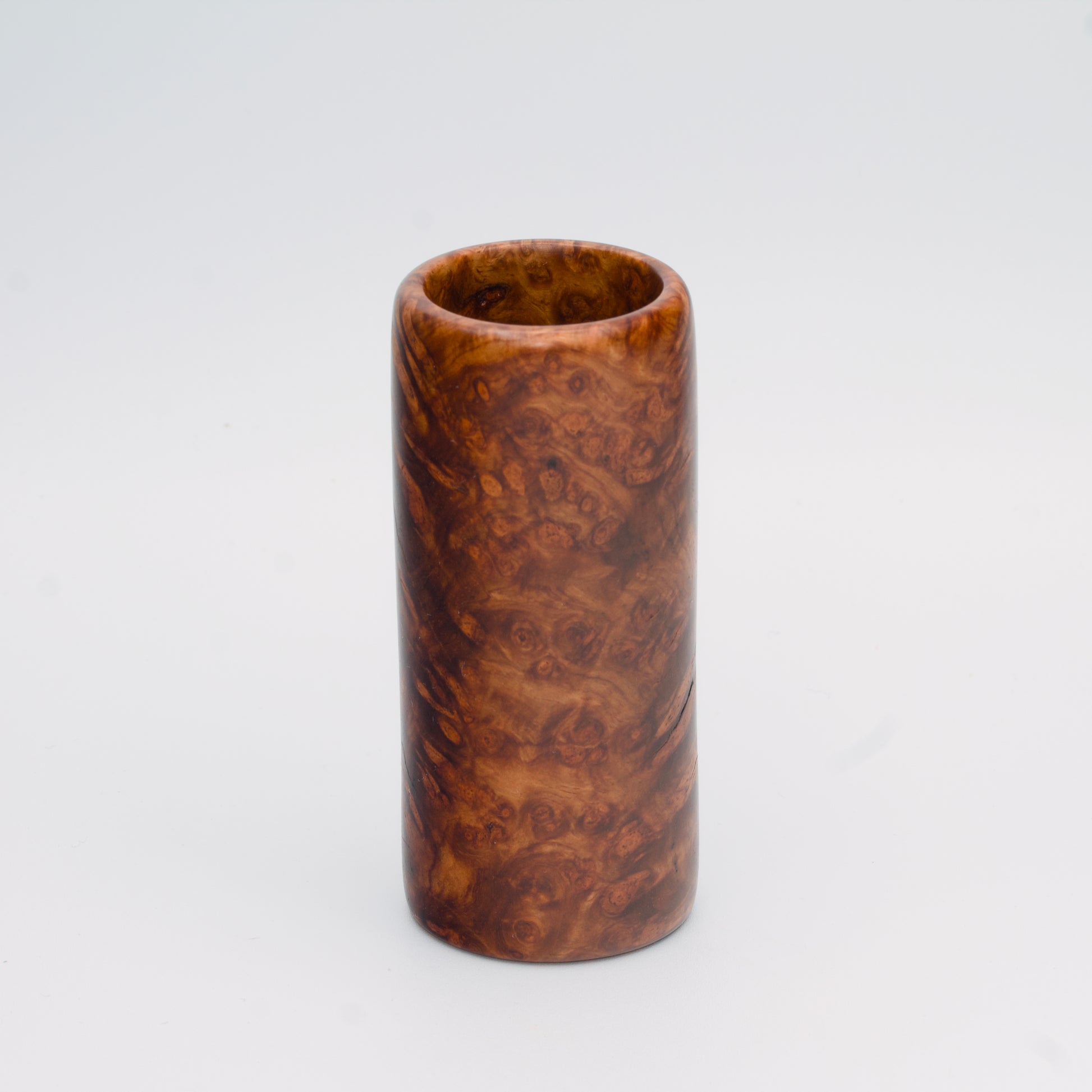 Big Leaf Maple Burl wood shot glass against white background