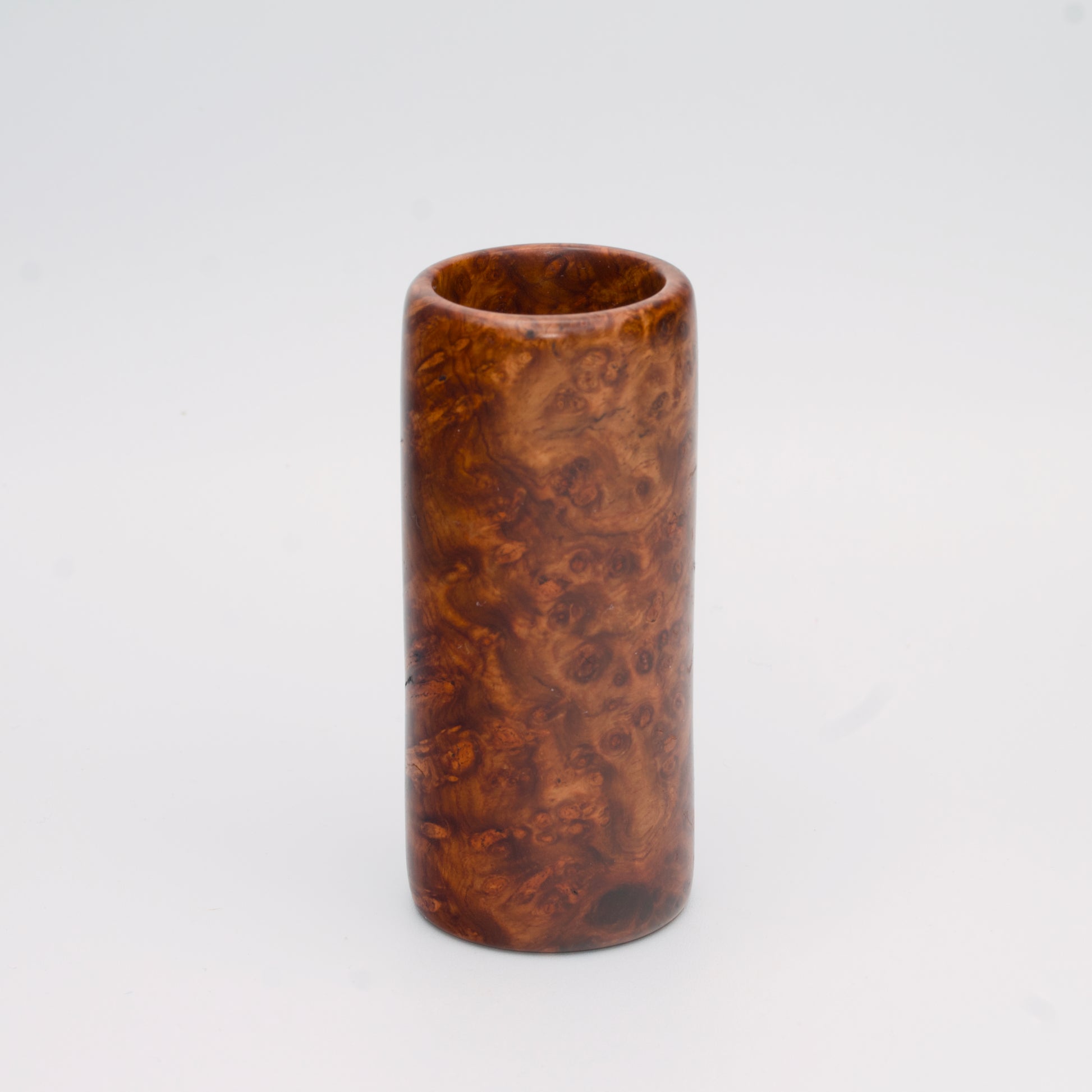 Big Leaf Maple Burl wood shot glass against white background