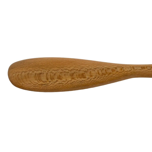 Wooden spoon on a beige background
