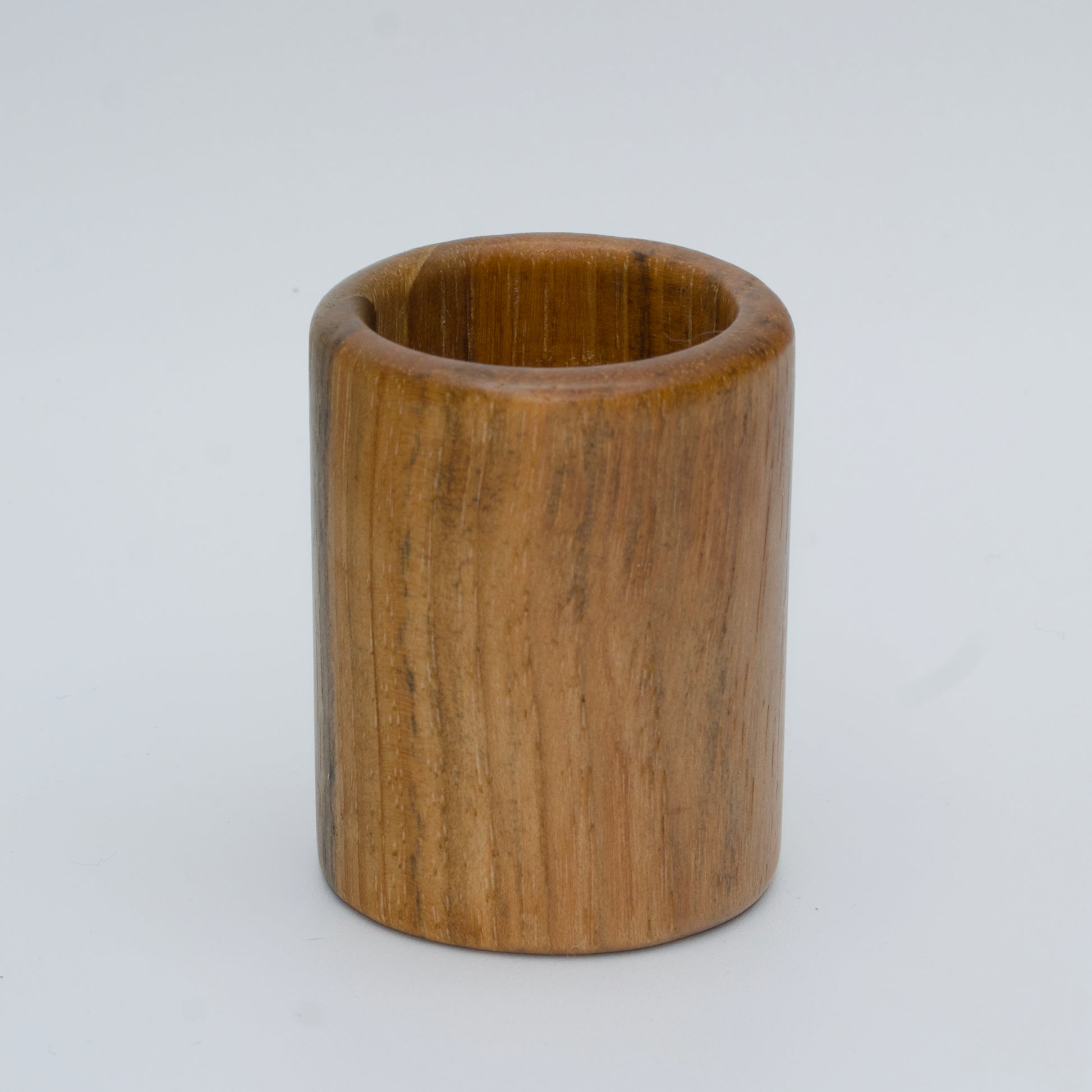 Pecan shot glass against white background