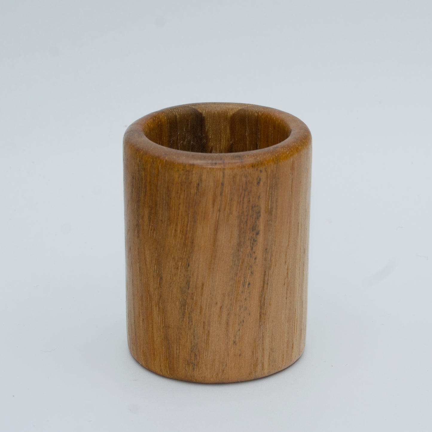 Pecan shot glass against white background