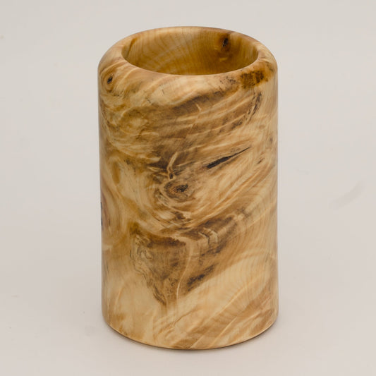 Buckeye burl wood shot glass against white background