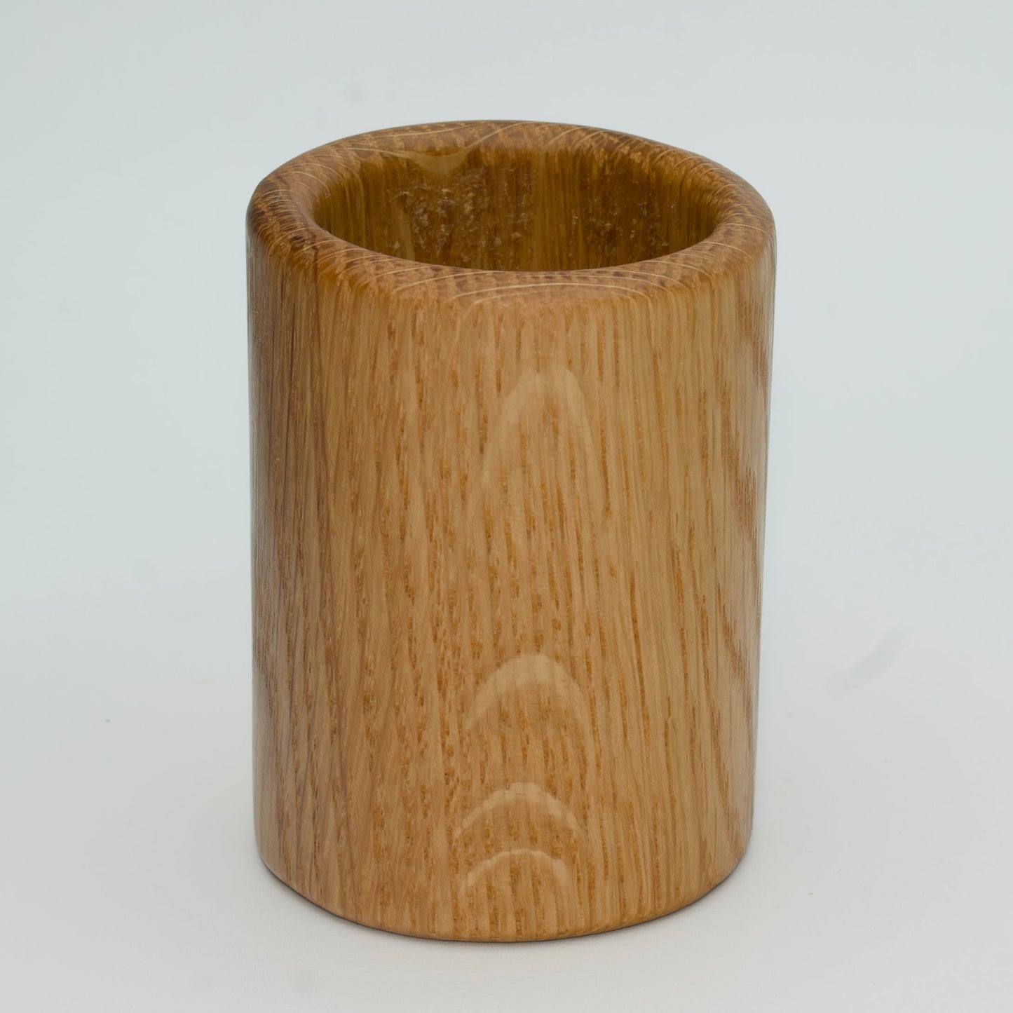 Oak shot glass against white background