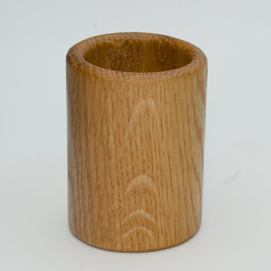 Oak shot glass against white background