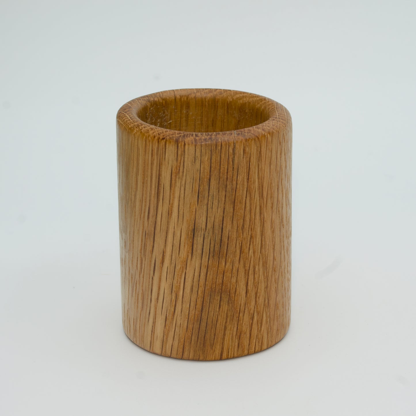 Oak shot glass against white background