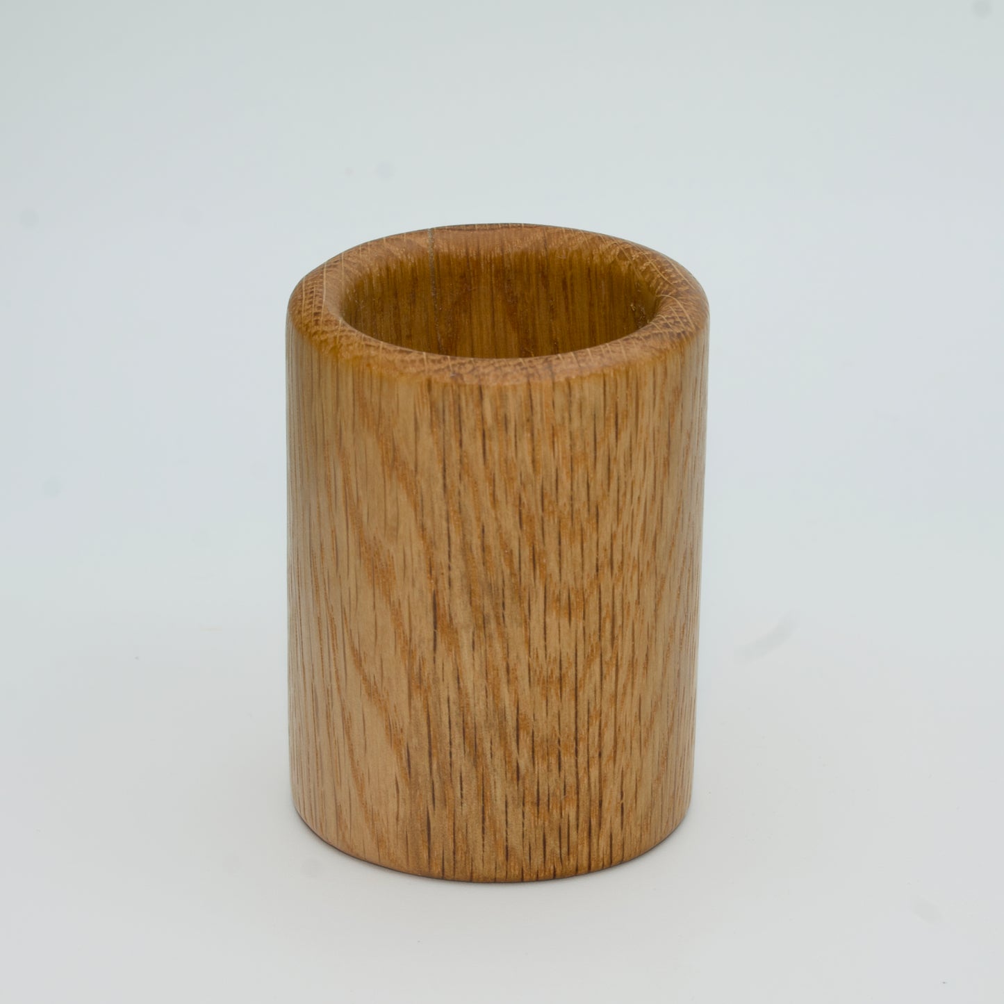 Oak shot glass against white background