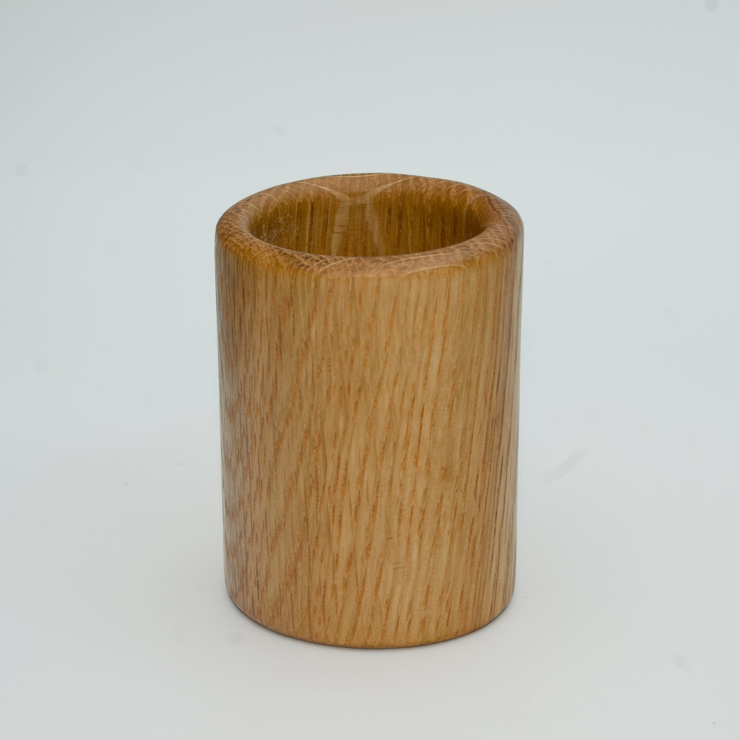 Oak shot glass against white background