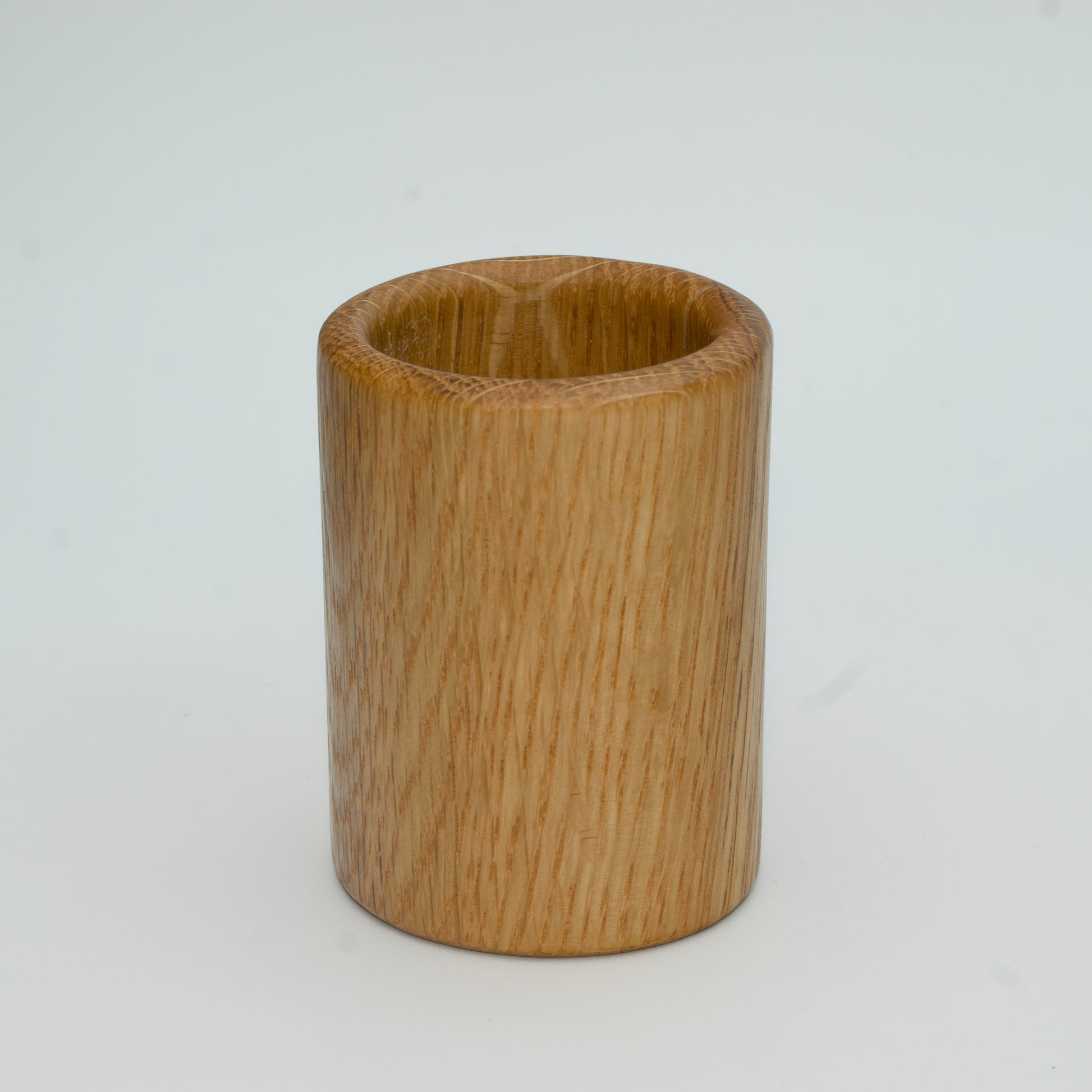 Oak shot glass against white background