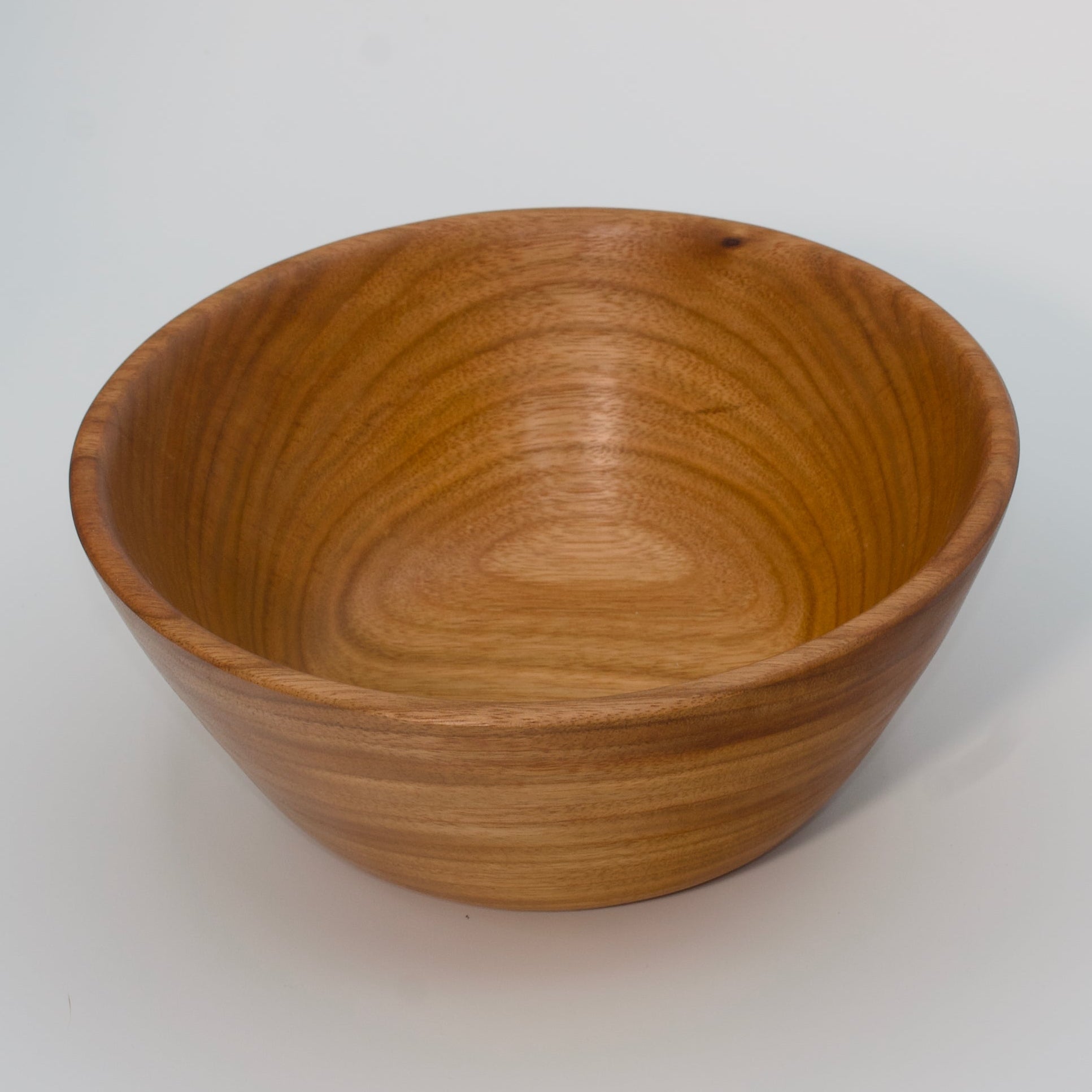 Wooden bowl on a white background