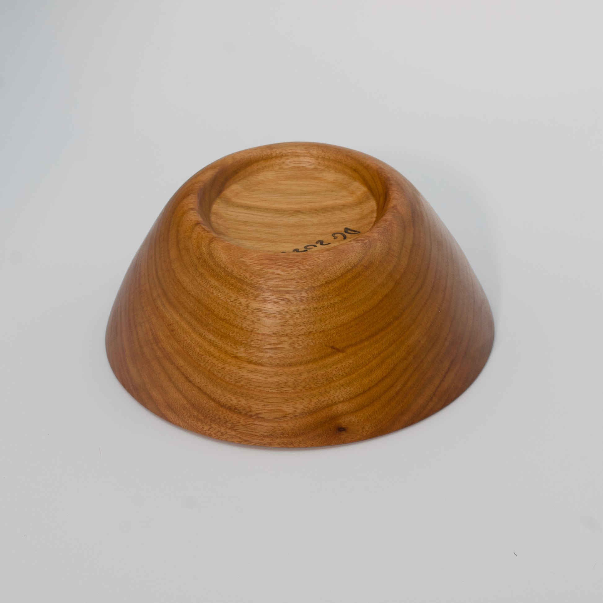Wooden bowl on a white background