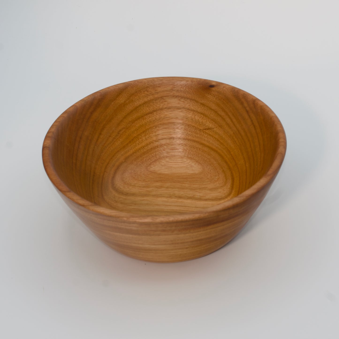 Wooden bowl on a white background