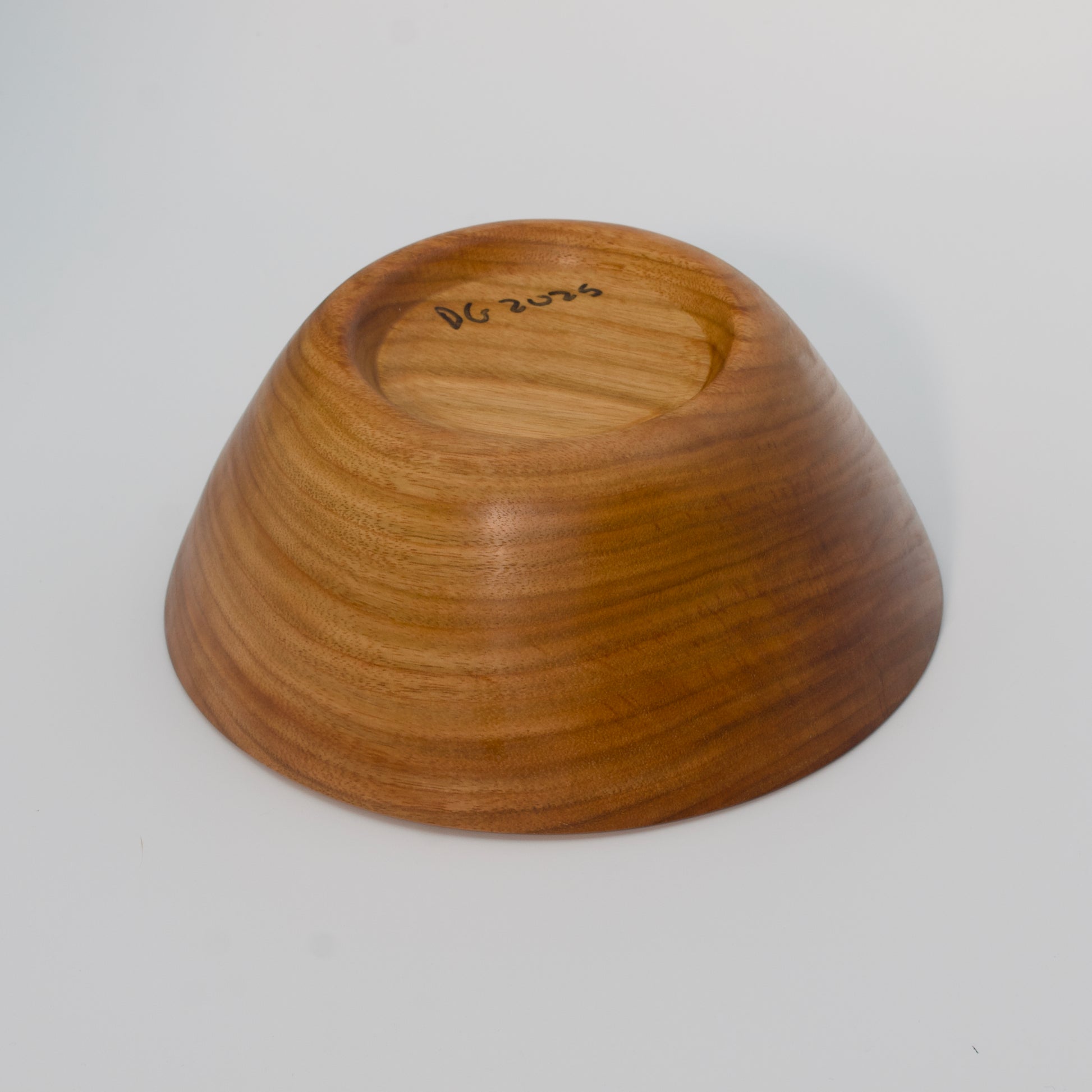 Wooden bowl on a white background