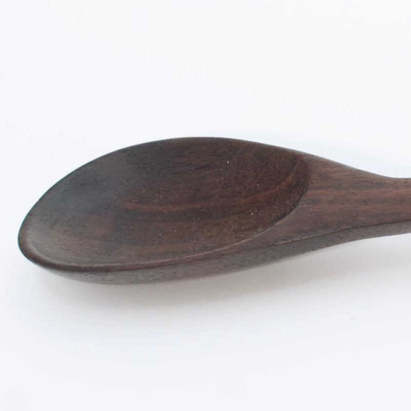 Wooden spoon on a white background