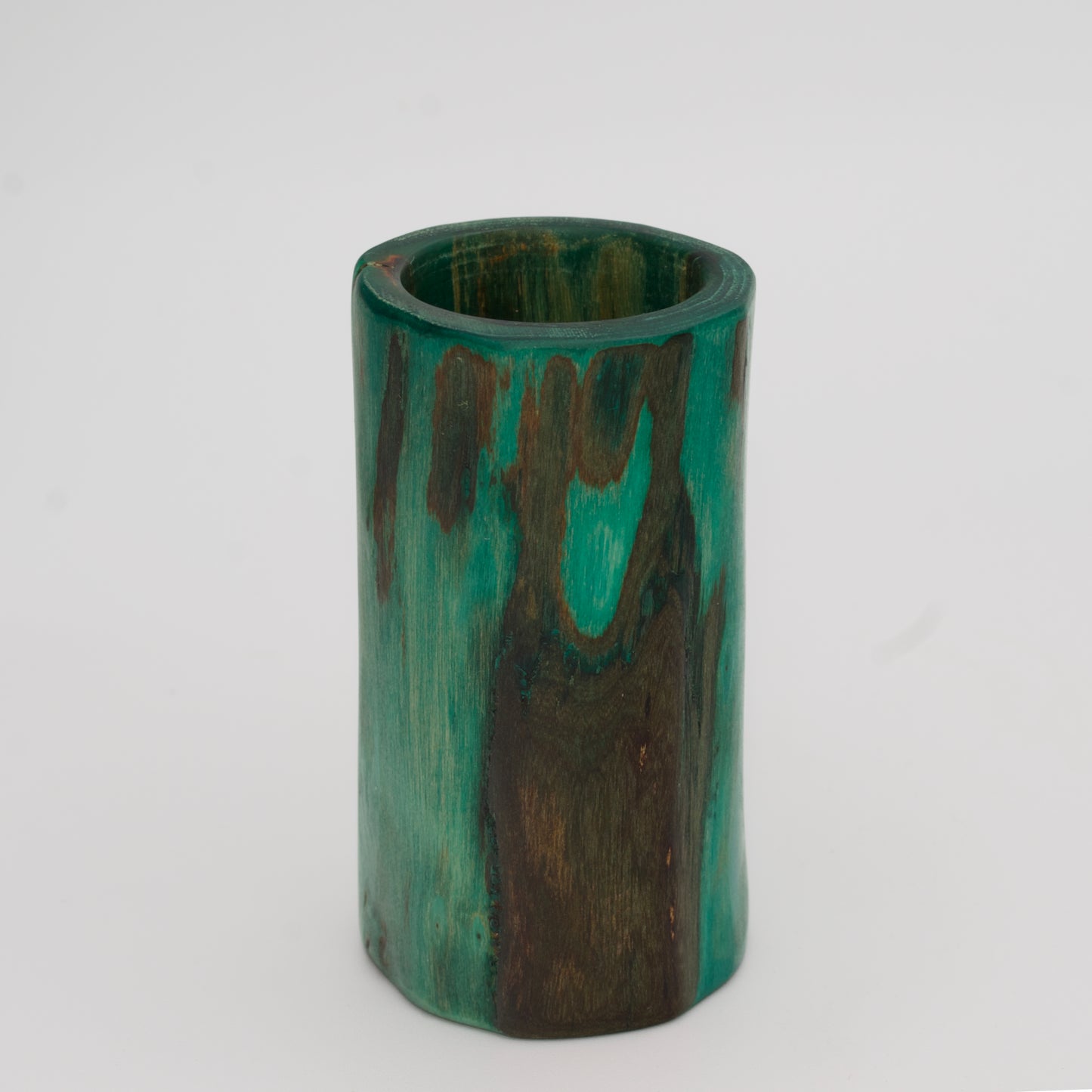 Green plains cottonwood shot glass on white background
