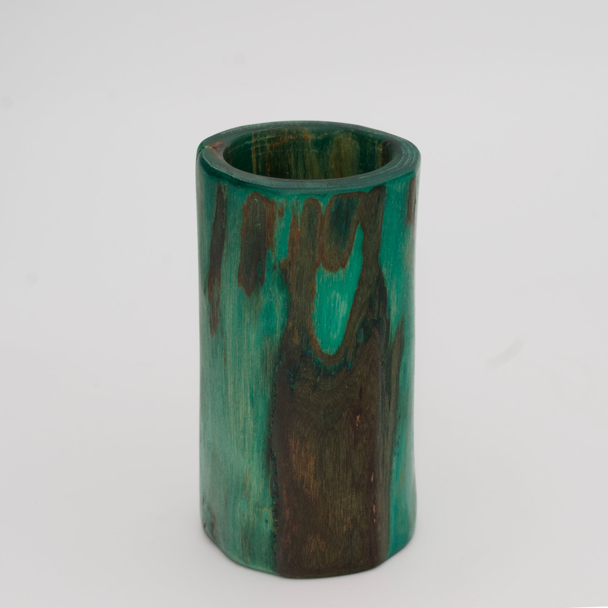 Green plains cottonwood shot glass on white background