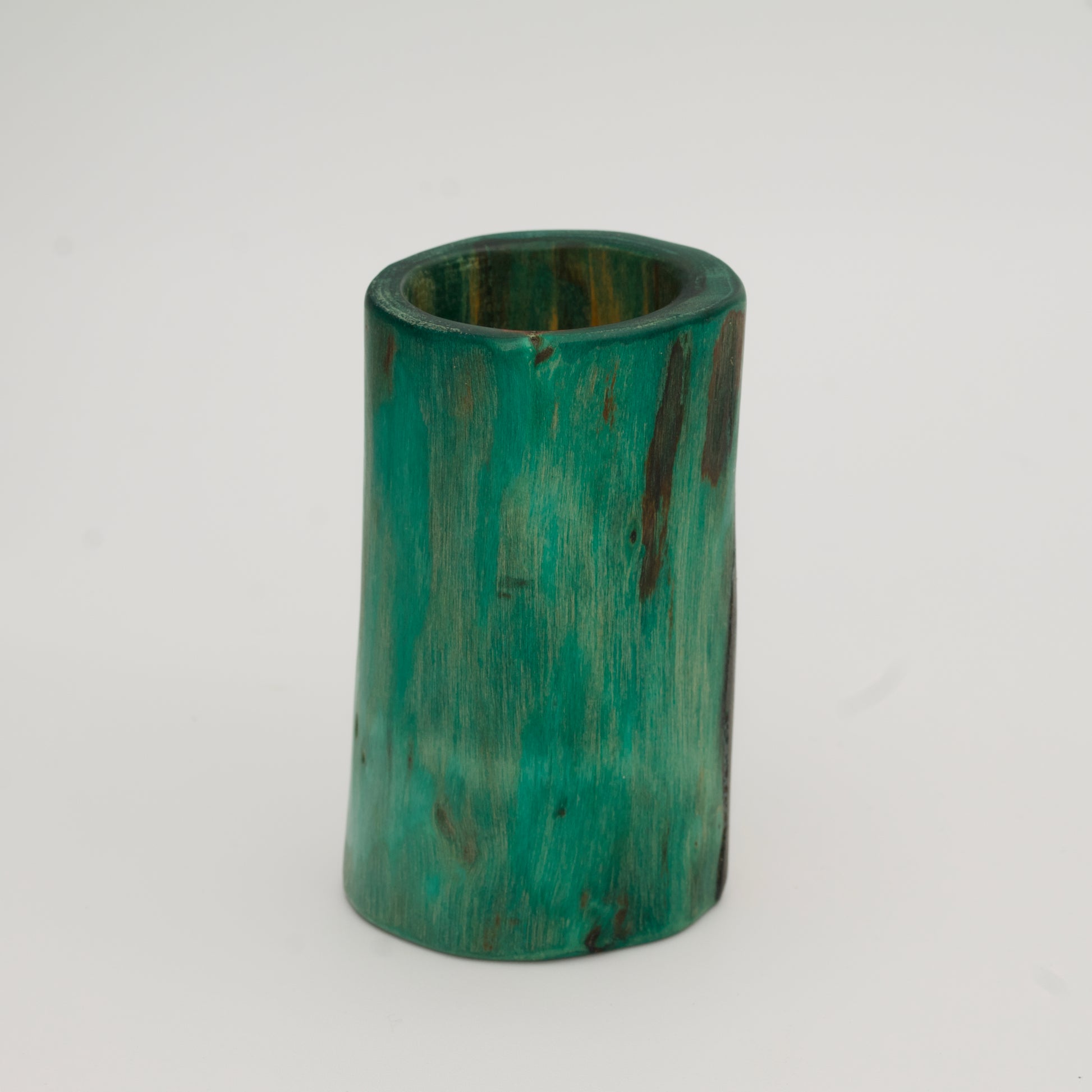 Green plains cottonwood shot glass on white background