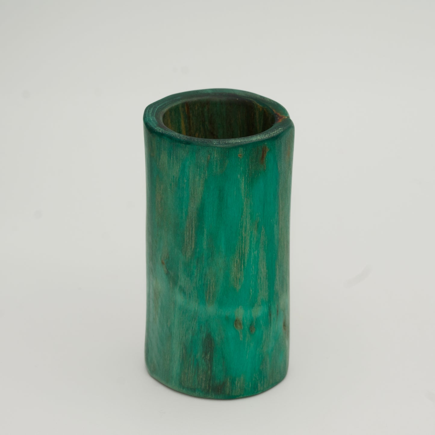 Green plains cottonwood shot glass on white background